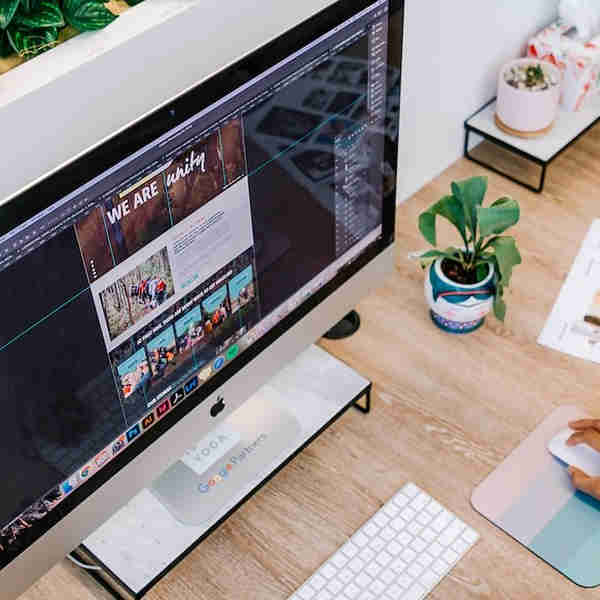 Web designers working on a website in a Liverpool office